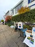 Künstlerische Maler auf der Promenade