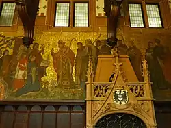 Rathaus St. Johann, Gemälde im Rathausfestsaal: Der heilige Arnulf von Metz weiht die erste Kapelle von St. Johann Graf Johann I. von Saarbrücken übergibt den Freiheitsbrief von 1322
