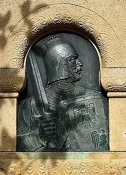 Emichbrunnen Grünstadt, Bronzerelief nach Gemälde von Guido Philipp Schmitt