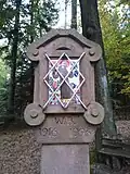 Der Kopf des Bildstockes, St. Franziskus darstellend