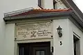 Haustafel an einem Haus am Dorfplatz