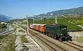 Ae 4/7 von SBB Historic mit einem historischen Güterzug im Wallis.
