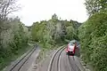 Nordausfahrt mit Neigetechnik-Nahverkehrstriebwagen Baureihe 612 nach Marktredwitz, links das Bayreuther Gleis