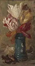 Tulpen in einem grünen Albarello