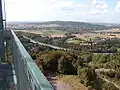 Blick über die BAB&nbsp;2 nach Bad Eilsen am Harrl mit dem Kraftwerk Heyden rechts am Horizont