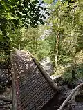 Unterspülte Brücke am Klammende
