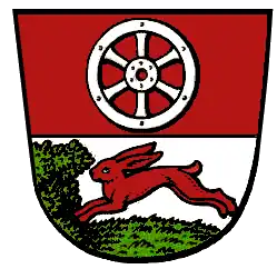 Haßloch (Rüsselsheim am Main): Oben im Wappen das Mainzer Rad, unten ein laufender Hase.