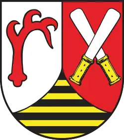 Wappen des ehema­ligen Landkreises Quedlinburg mit gekreuzten Kredenz­messern