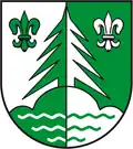Gespalten von Silber und Grün, in verwechselten Tinkturen eine von zwei Lilien begleitete Tanne auf einem mit drei Wellenlinien belegten Dreiberg&nbsp;∗ (Brocken-Hochharz, DE)