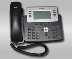 Ein schwarz-graues schnurgebundenes Telefon mit LC-Display