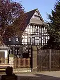 Die Villa Hubertus an der Kölner Straße ist ein herrschaftlicher Fachwerkbau aus dem Jahre 1917, der inmitten eines großzügigen Parks an der Kölner Straße liegt. Zuvor befand sich an diesem Platz das Sägewerk der Unternehmerfamilie Milz, die seit dem späten 19. Jahrhundert Hauptarbeitgeber in Marmagen war.
