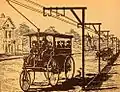 Dibble-Anlage mit jeweils einer Fahrleitung pro Fahrtrichtung, hinten ein weiterer Wagen