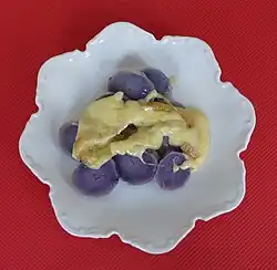 gekochte Blaue St. Galler mit geschmolzenen Raclette-Käse