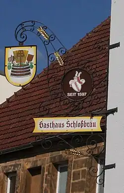 Wirtshausausleger vom Schlossbräu